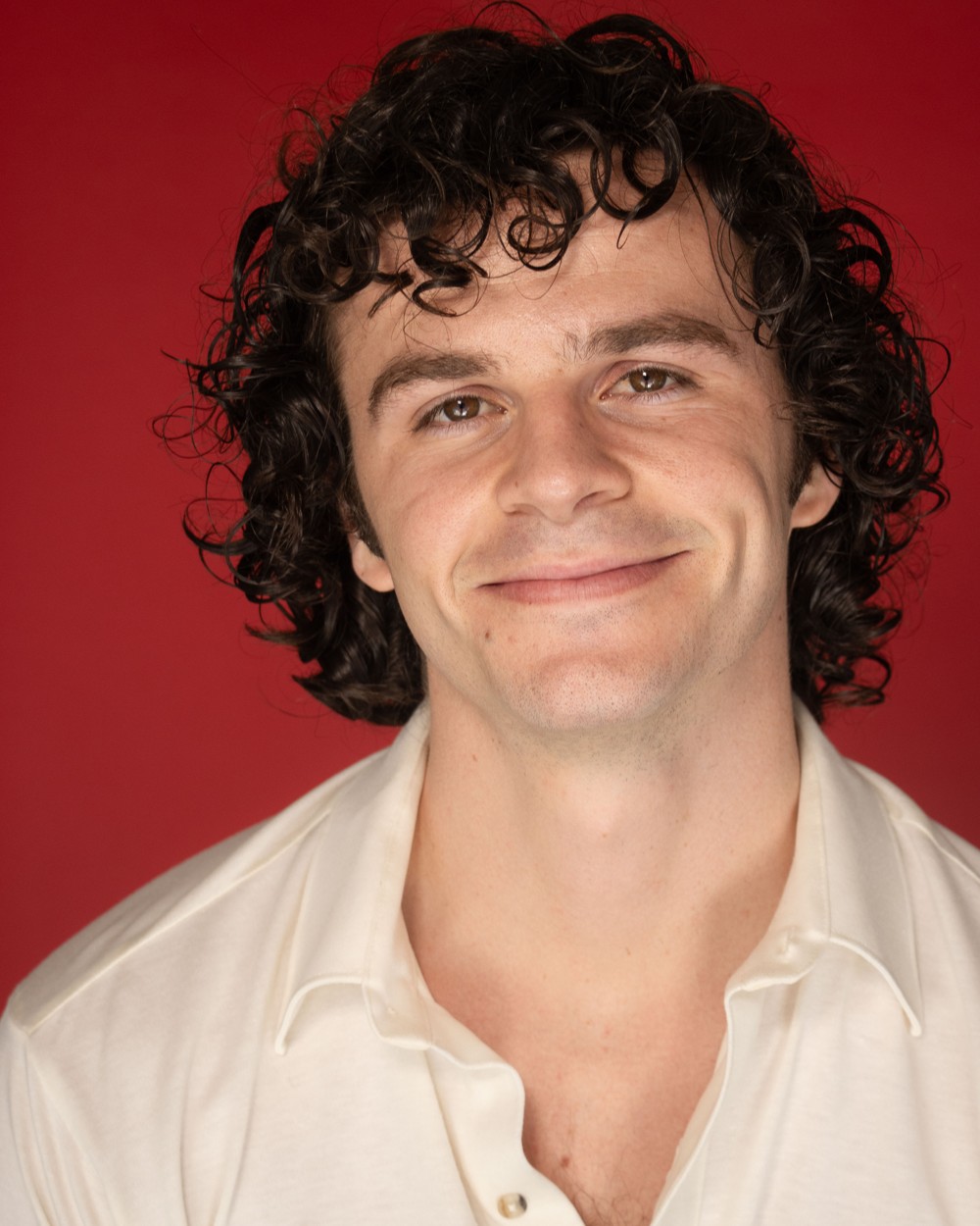 Bernard Hefner headshot, red background