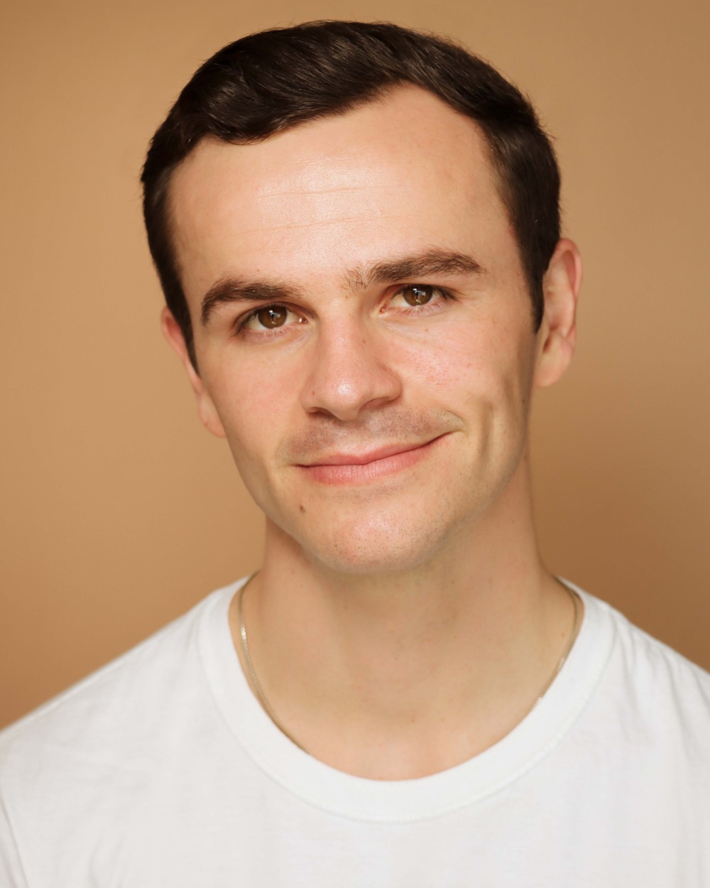 Bernard Hefner headshot, tan background